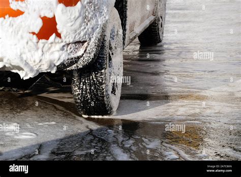 Car is cleaning with soap suds at self-service car wash. White soap ...