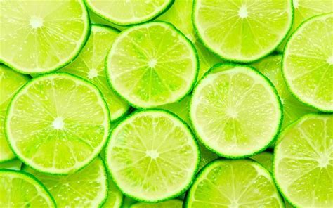 Download wallpapers limes, green lemons, lemon wedges, tropical fruits, lemons, fruits, lemon ...