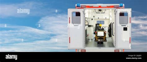 Rear view of the interior of an open ambulance in front of a blue sky with copy space Stock ...