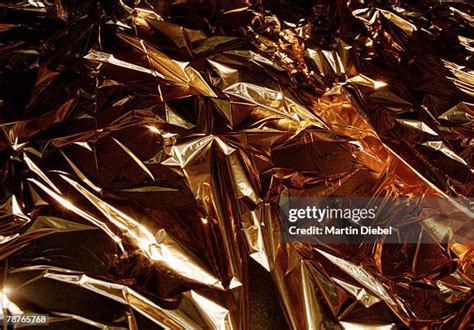 Gold Foil Wrapping Paper Photos and Premium High Res Pictures - Getty ...