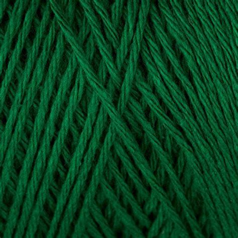 green yarn is in the shape of a ball