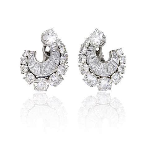 A Pair Of Diamond Earrings at 1stdibs