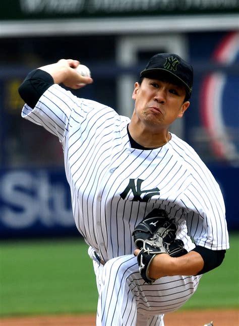 Yankees starting pitcher Masahiro Tanaka throws a strike - Gold Medal ...