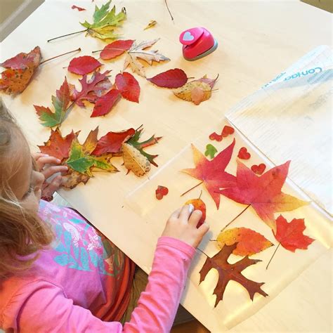 These beautiful autumn leaf suncatchers are made with transparent contact paper and fresh autumn ...