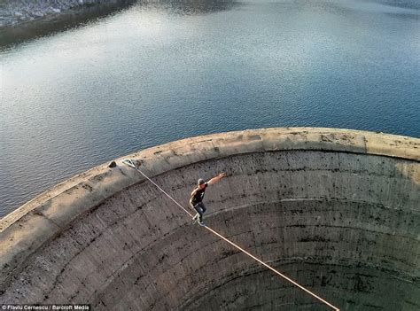 Slack-liner tip-toes across Romanian drain hole above 200ft blackhole ...