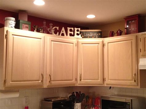 I never knew what to do with the extra space above cabinets. Now I know... (this is the kitchen ...