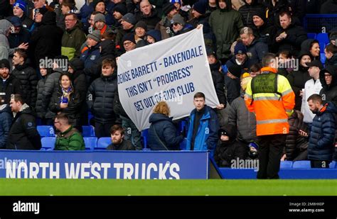 Everton fans hold up banners in protest against the clubs board ahead ...