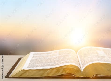 Holy Bible book on a wooden background Stock Photo | Adobe Stock