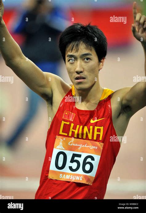 Chinas star hurdler Liu Xiang celebrates after winning the mens 110m ...