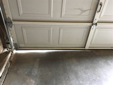 How do I fix this gap on the bottom side of my garage door? : HomeImprovement