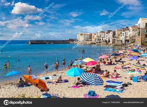 Sandy beach in Cefalu in Sicily – Stock Editorial Photo © bloodua #164653546