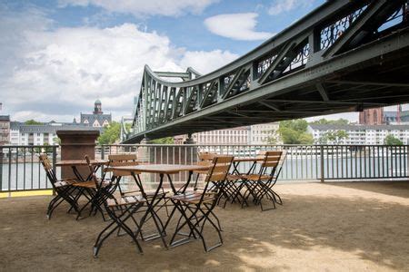 Eiserner Steg Bridge with Cafe Table and Chairs; Frankfurt; Germany; | Freestock photos