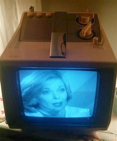 an old tv sitting on top of a table