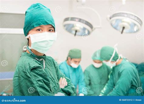 Portrait Of Nurse Working In Operating Theatre Stock Photo - Image: 56872312