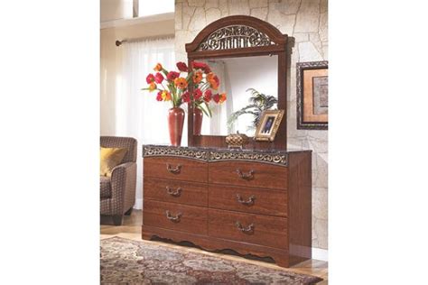 faux marble top and ornate hardware add classic traditional style to this cherry wood dresser ...