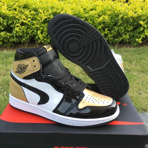 Upside Down Swoosh Lands on the Air Jordan 1 ‘Gold Toe – Jordans To U