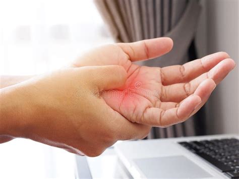 Asian Woman Suffering with Hand Pain from Working with Laptop Computer, Aches and Pain Medical ...