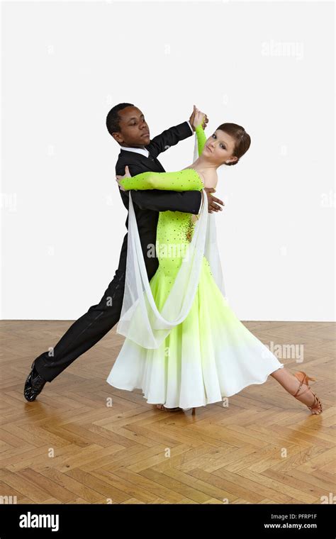 Teenage boy and girl performing throwaway oversway dance move Stock ...