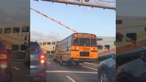 Alarming photo of school bus under train crossing arm leads to ...