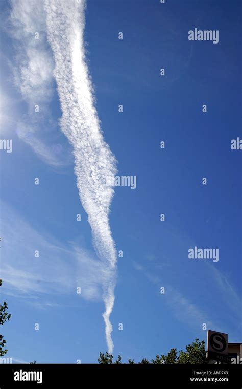 Vapor trail of an airplane Stock Photo - Alamy