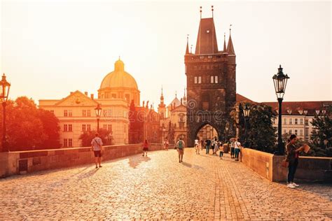 Prague, Sunrise Over Charles Bridge with Tourist Walking through. Editorial Image - Image of ...