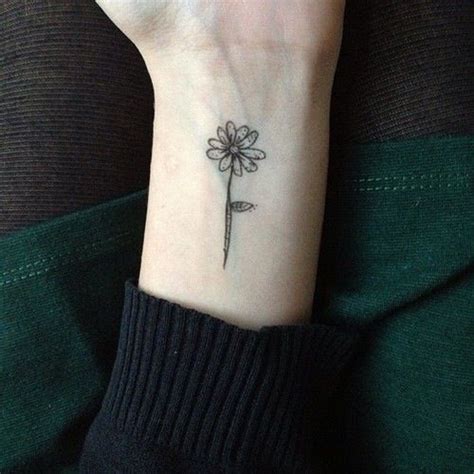 12 Pretty Daisy Tattoo Designs You May Love - Pretty Designs | Flower wrist tattoos, Tattoo ...