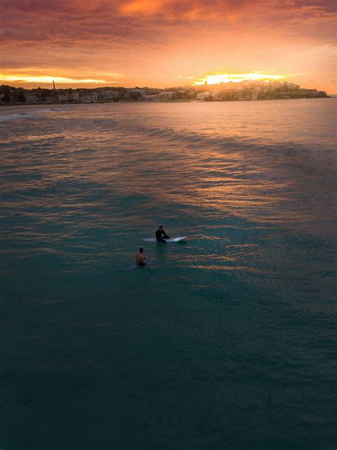 Photo of Two People Surfing in Bondi Beach · Free Stock Photo