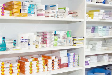 Pharmacy shelves - Stock Image - M640/0280 - Science Photo Library