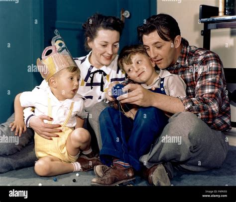 Robert Mitchum and his wife Dorothy with his two children, Christopher (left) and James (right ...