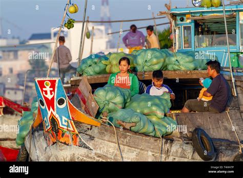 Chau Doc, Vietnam - March 6, 2019 : family in boat selling melons in ...