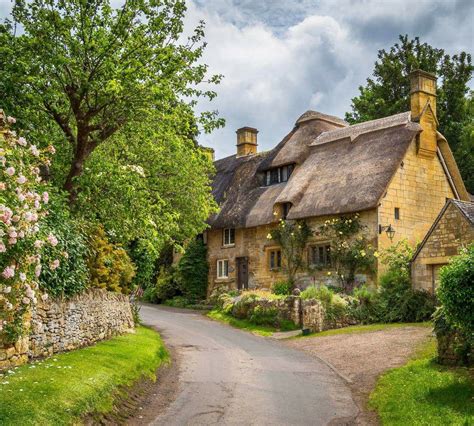 Beautiful thatched cottages in the little village of Stanton, Gloucestershire, in the Cotswolds ...