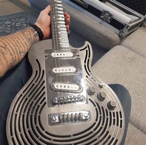 This custom made electric guitar made out of titanium : mildlyinteresting