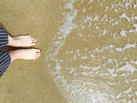 Free Images : hand, sand, shoe, white, floor, travel, leg, pattern, yellow, material, human body ...