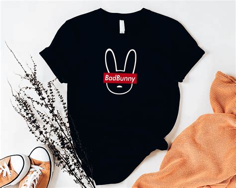 Bad Bunny tshirt, Bad bunny logo shirt, Handmade in 2022 | Logo shirts, Shirts, T shirts for women