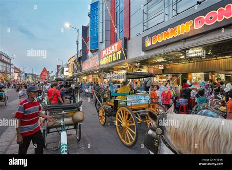 Malioboro Street illuminated at dusk. Yogyakarta, Java, Indonesia Stock ...