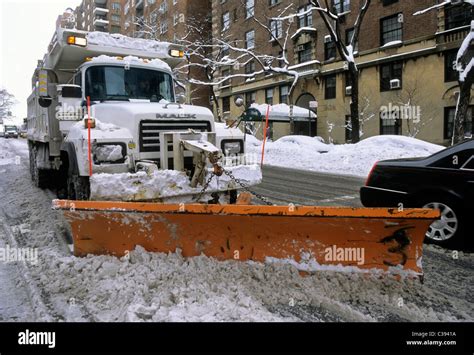 Snow plow clearing street after a major snowstorm in New York City USA ...