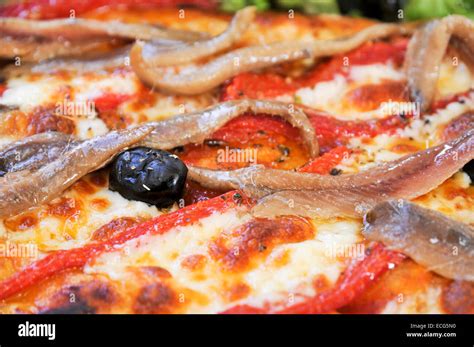 Anchovies and black olives on a Pizza Stock Photo - Alamy