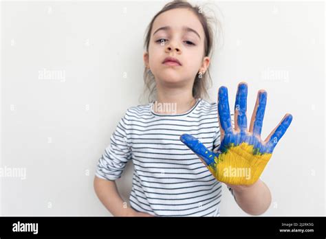Child's hands painted on Ukraine flag colors Stock Photo - Alamy
