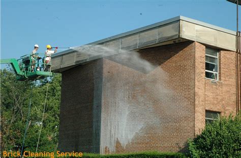 Brick Cleaning – Workers cleaning brick wall | Commercial Restorations ...