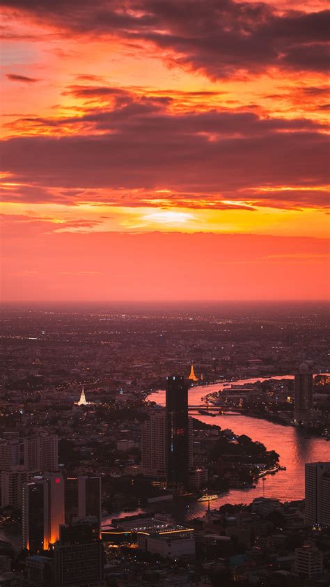 Download wallpaper 1350x2400 city, sunset, aerial view, buildings, river, dusk iphone 8+/7+/6s ...
