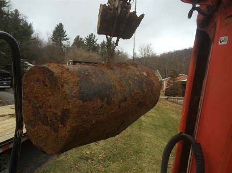 Old oil barrel removal. | Triplett Excavating