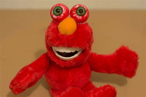 Download Funny Elmo Creepy Red Eyes Doll Picture | Wallpapers.com