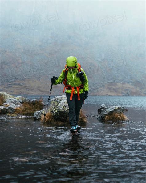 Landscape photographer walking in the rain | Premium Photo - rawpixel