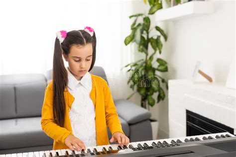 Beautiful Little Girl Playing Piano in Light Room Stock Photo - Image ...