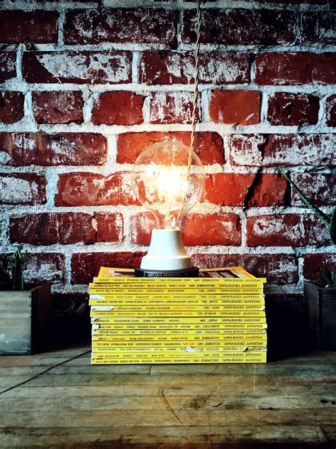 Free picture: wooden surface, books, texture, bricks, wall lamp, light bulb