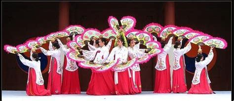 a group of women in red and white outfits standing next to each other on stage