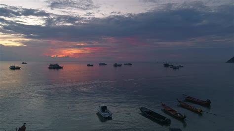 Sunset Beach Scene with Boats 38078185 Stock Video at Vecteezy