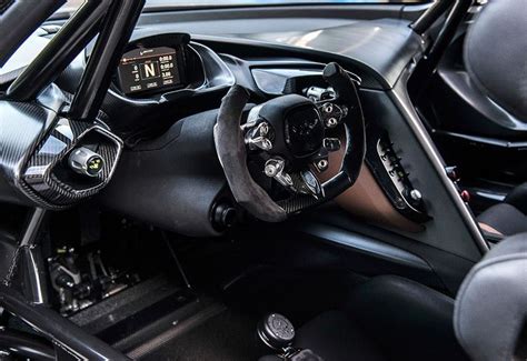 the interior of a car with steering wheel and dashboard