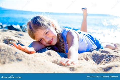 Blond Child Lying on Sandy Beach of Sea Coast Stock Photo - Image of coastline, children: 177181190