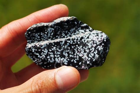 Obsidian Volcanic Rock from United States Held in a Hand Stock Image - Image of gemstone, quartz ...